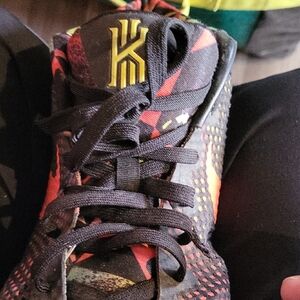 Nike Kyrie Basketball Shoe in Black with Red & Yellow Accents